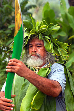Nooroa Tupa. As the baton travels around Cook Islands' capital, Rarotonga, Nooroa Tupa, a speaker for Ngati Makea Tribe in Teauotonga Village inspects its unique shape and form.