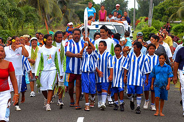 Aitutaki soccer team. The Aitutaki soccer team parades with the baton as the Melbourne 2006 Commonwealth Games Queen's Baton Relay continues in the Cook Islands.