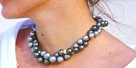 Typical black pearl necklace around a beautiful women neck